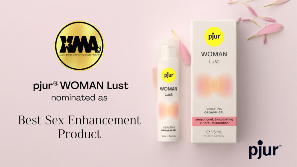 Graphic of pjur WOMAN Lust with packaging on a pink gradient background, mentioning its nomination as "Best Sex Enhancement Product" at the XMA Awards 2025.